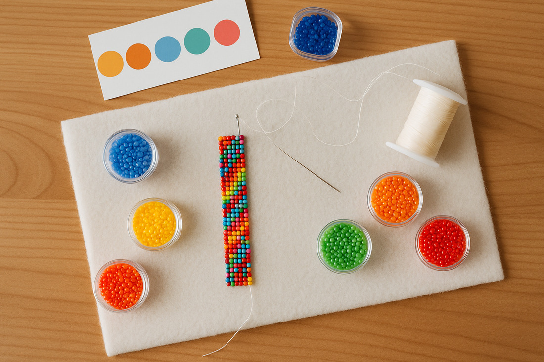 "10/0 seed bead bracelet in bright colors on a beading workspace—white bead mat on a wooden desk, with beads, beading needle, thread spool, and small containers in view."