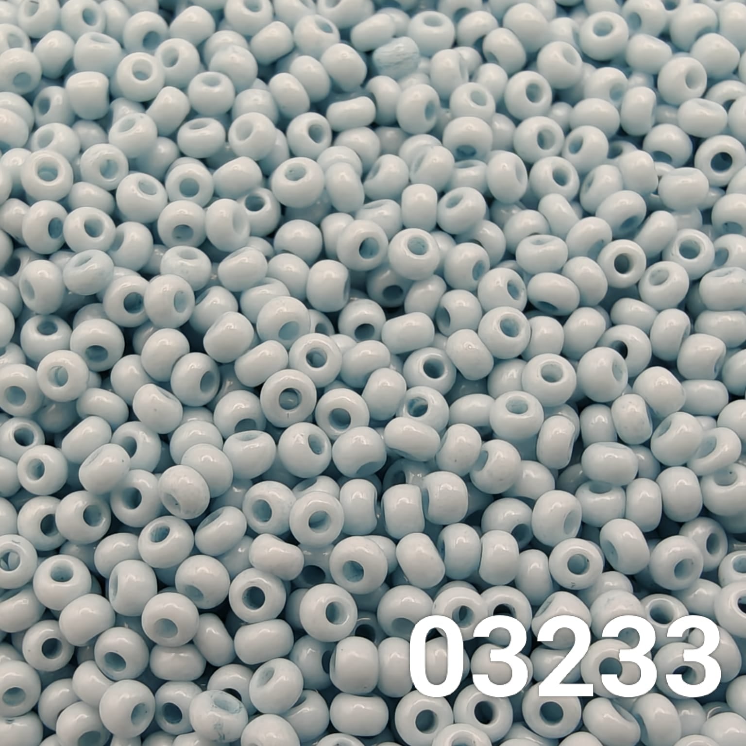 Close-up of Preciosa 10/0 seed beads in Solgel Chalk Blue-Green color (03233)
