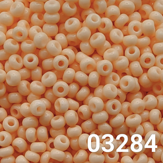 Close-up of Preciosa Czech Seed Beads 10/0 in Solgel Chalk Orange 03284 – loose beads