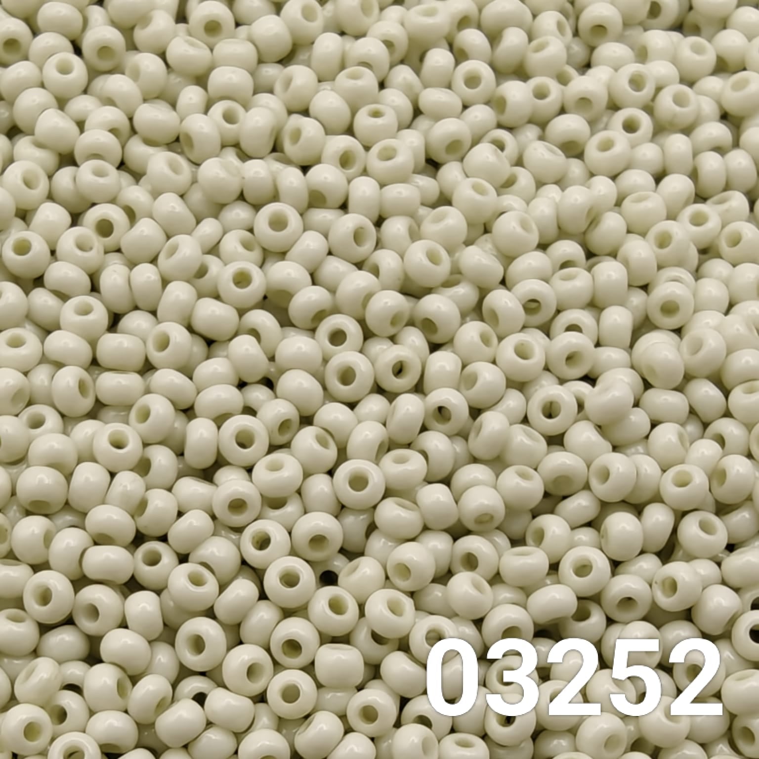 Close-up of Preciosa 10/0 seed beads in Solgel Chalk Grey color (03241)