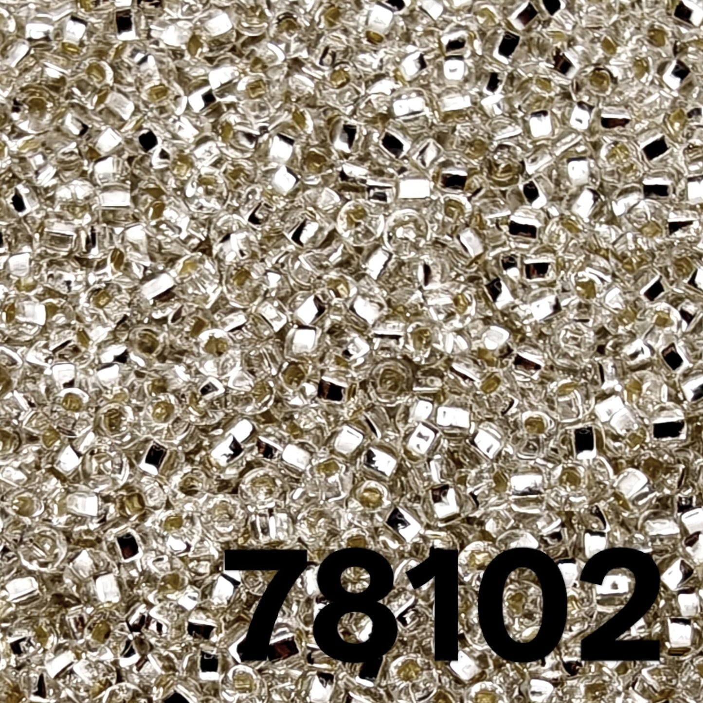 Close-up Preciosa 10/0 Silverlined Crystal seed beads 78102 — clear round rocailles with mirror-lined core, macro texture.