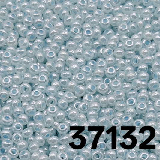 Close-up macro of Preciosa 10/0 pearlized baby blue Czech seed beads, code 37132.