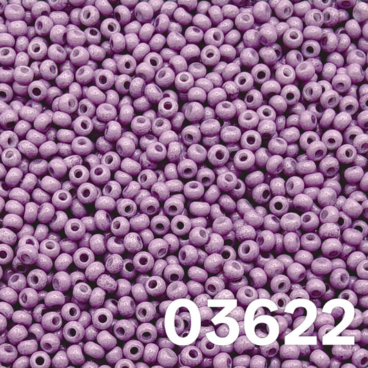 Close-up of Preciosa 10/0 Czech seed beads — Solgel Chalk Violet (03622), glossy violet