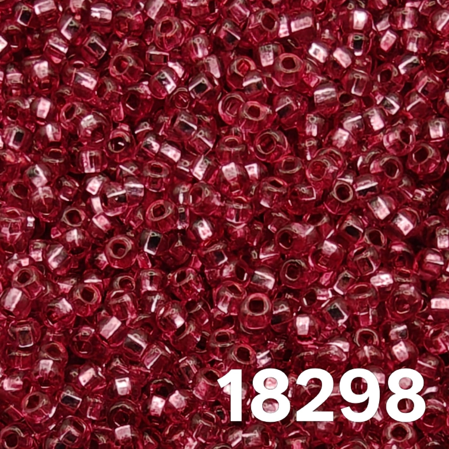 Close-up of Preciosa 10/0 seed beads, Silverlined Dyed Rose 18298