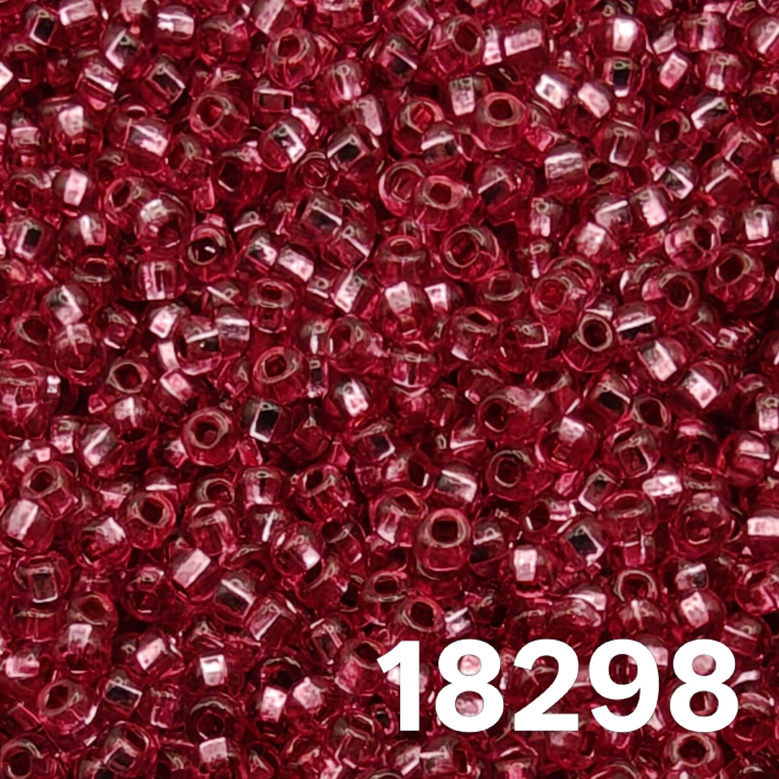 Close-up of Preciosa 10/0 seed beads, Silverlined Dyed Rose 18298