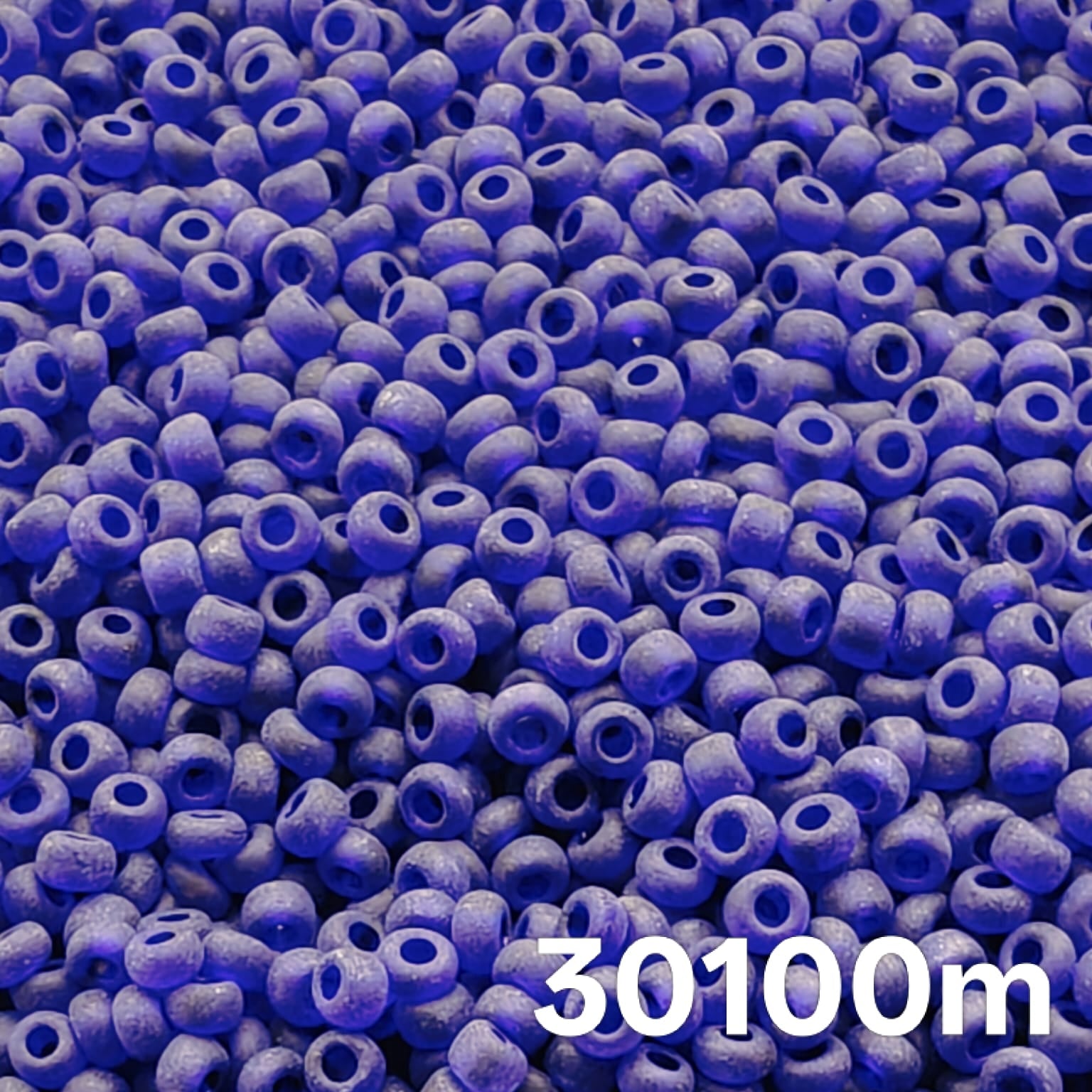 Close-up of Preciosa 10/0 seed beads, Transparent Matte Cobalt 30100M, frosted blue glass rounds
