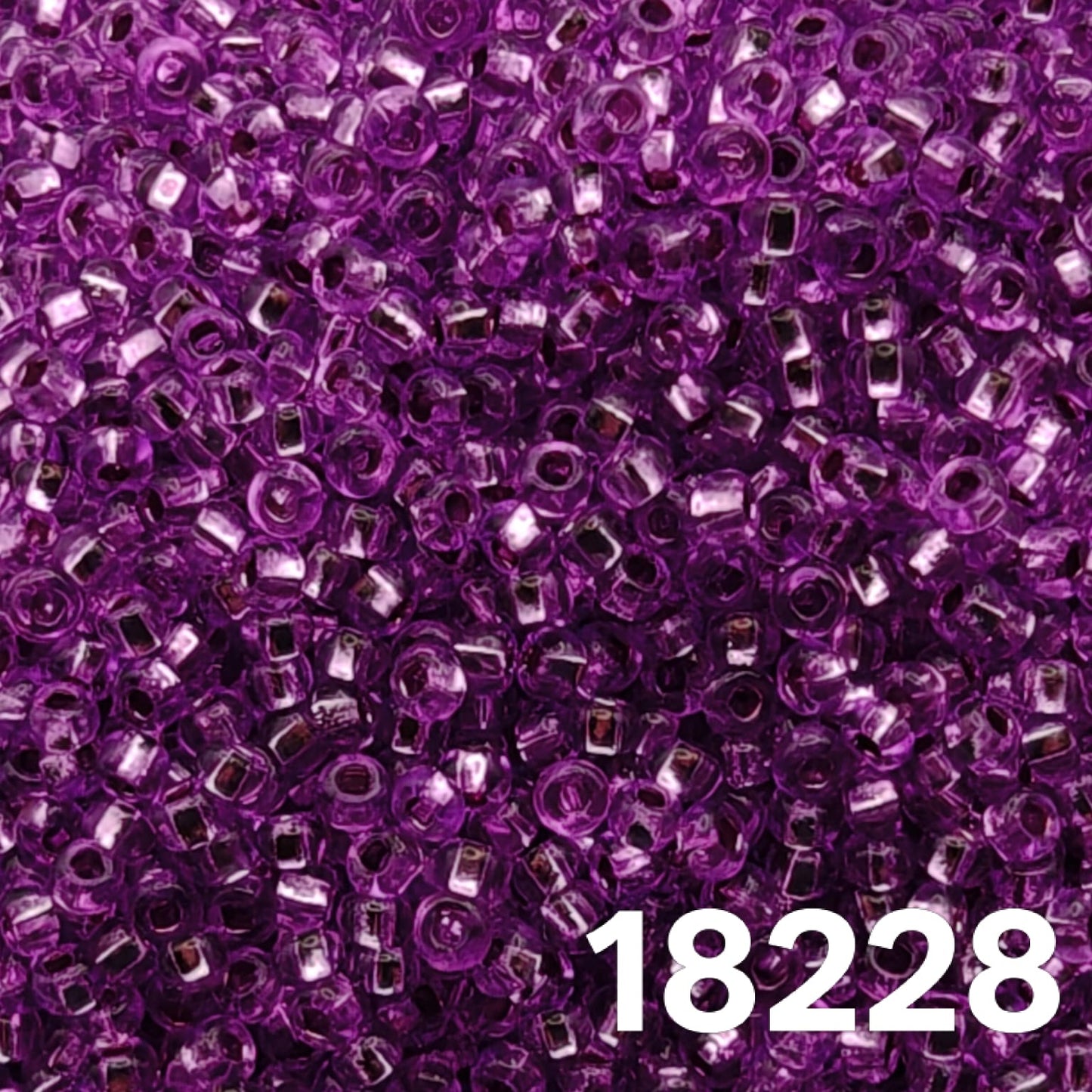 Close-up of Preciosa Czech seed beads 10/0 purple silverlined round beads for jewelry making