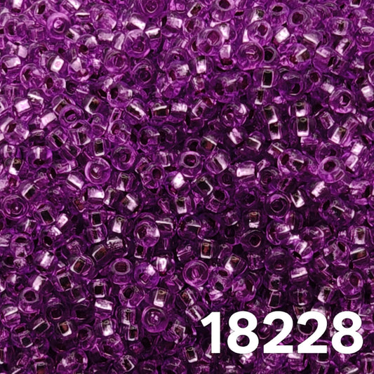 Close-up of Preciosa Czech seed beads 10/0 purple silverlined round beads for jewelry making