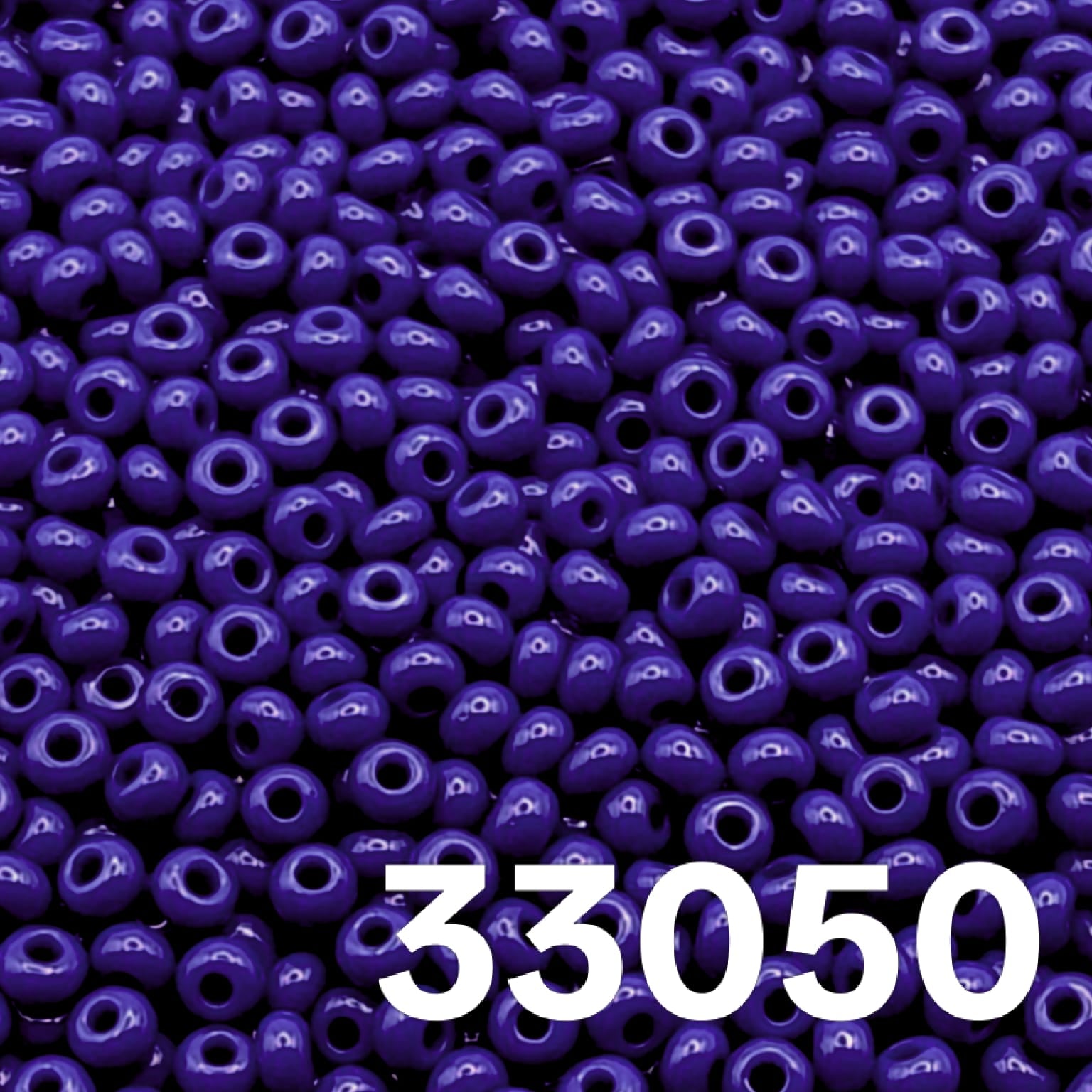 Close-up of round opaque Royal Blue Czech seed beads size 10/0 colour code 33050