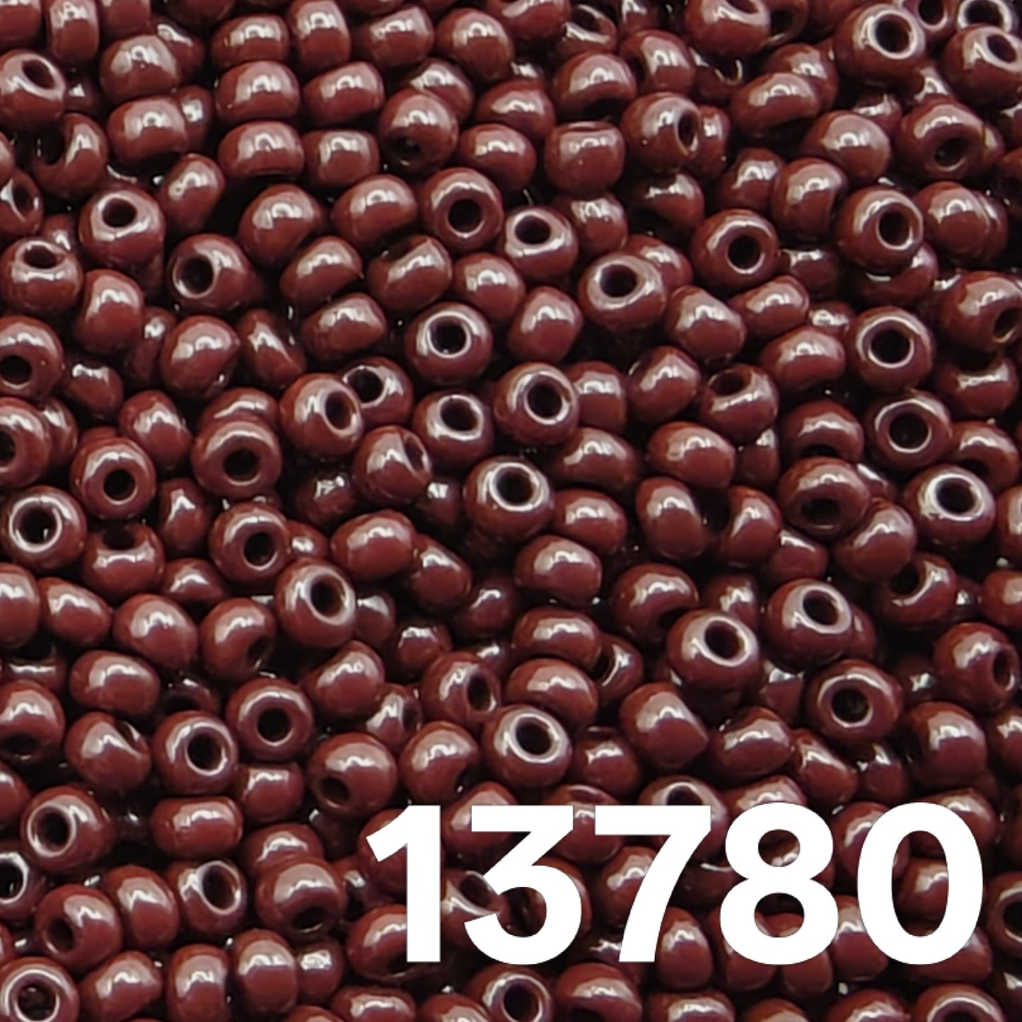 Close up of round Czech seed beads 10/0 opaque dark brown 13780 full frame