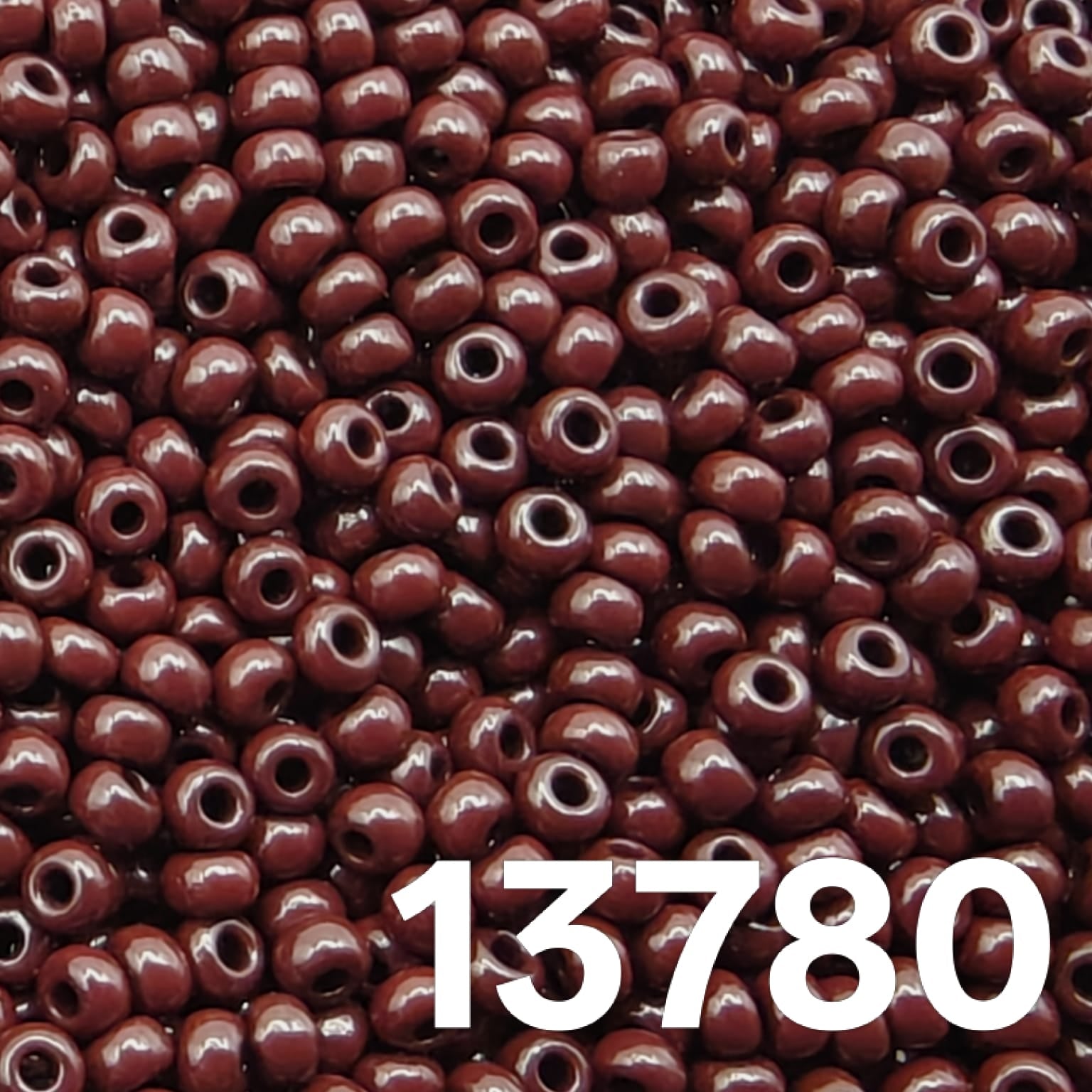 Close up of round Czech seed beads 10/0 opaque dark brown 13780 full frame
