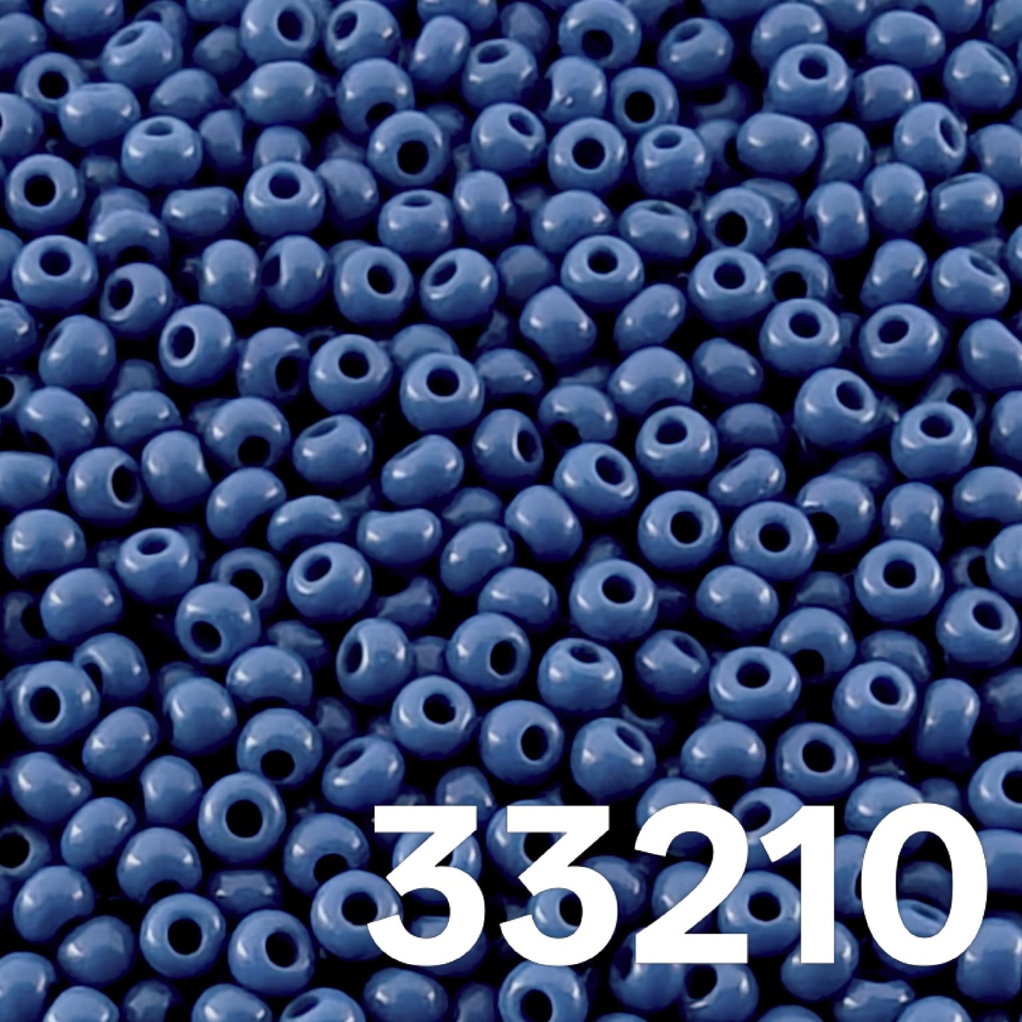 Close up of round opaque medium blue Czech seed beads 10/0 colour 33210