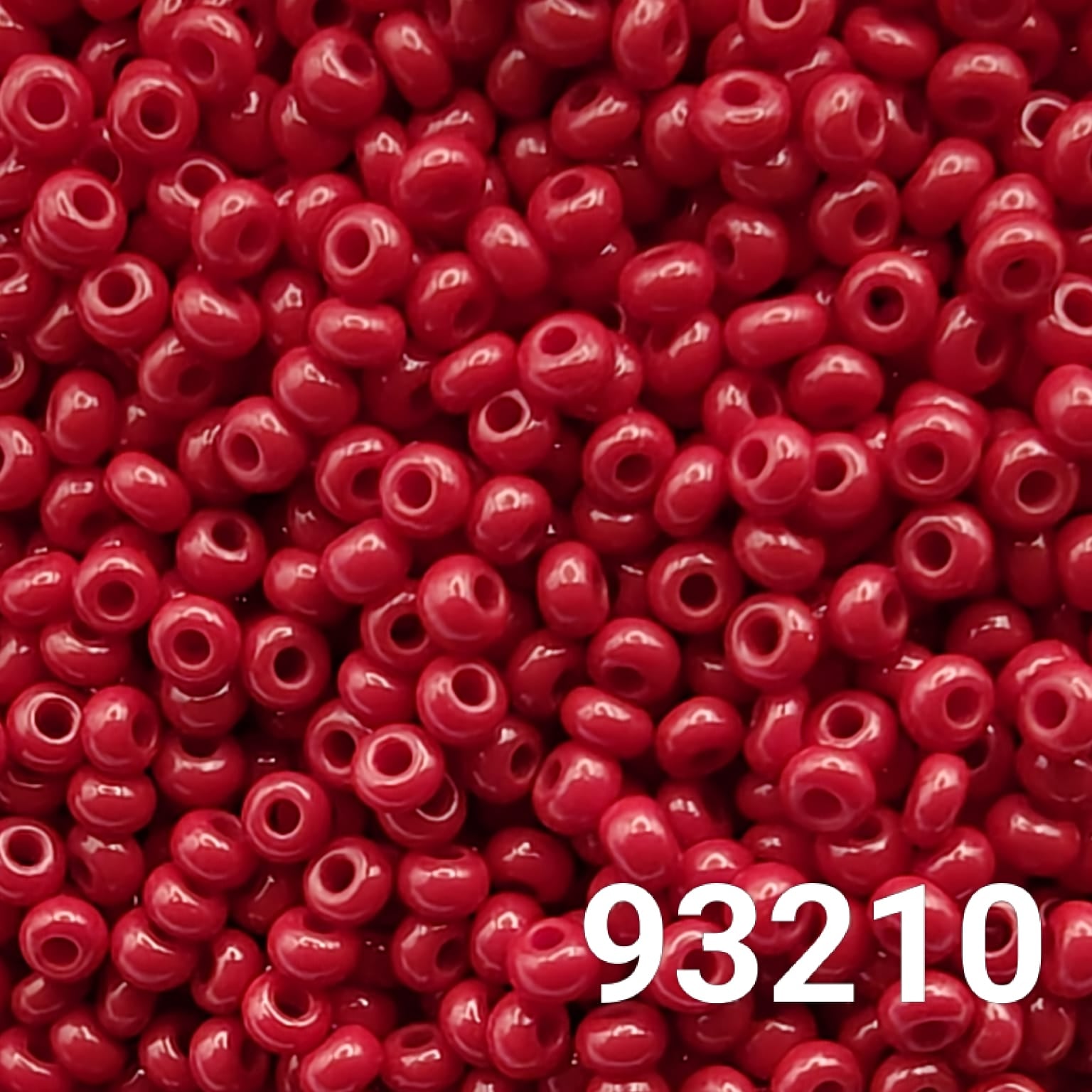 Close-up of Preciosa Czech seed beads 10/0 in opaque dark red color 93210