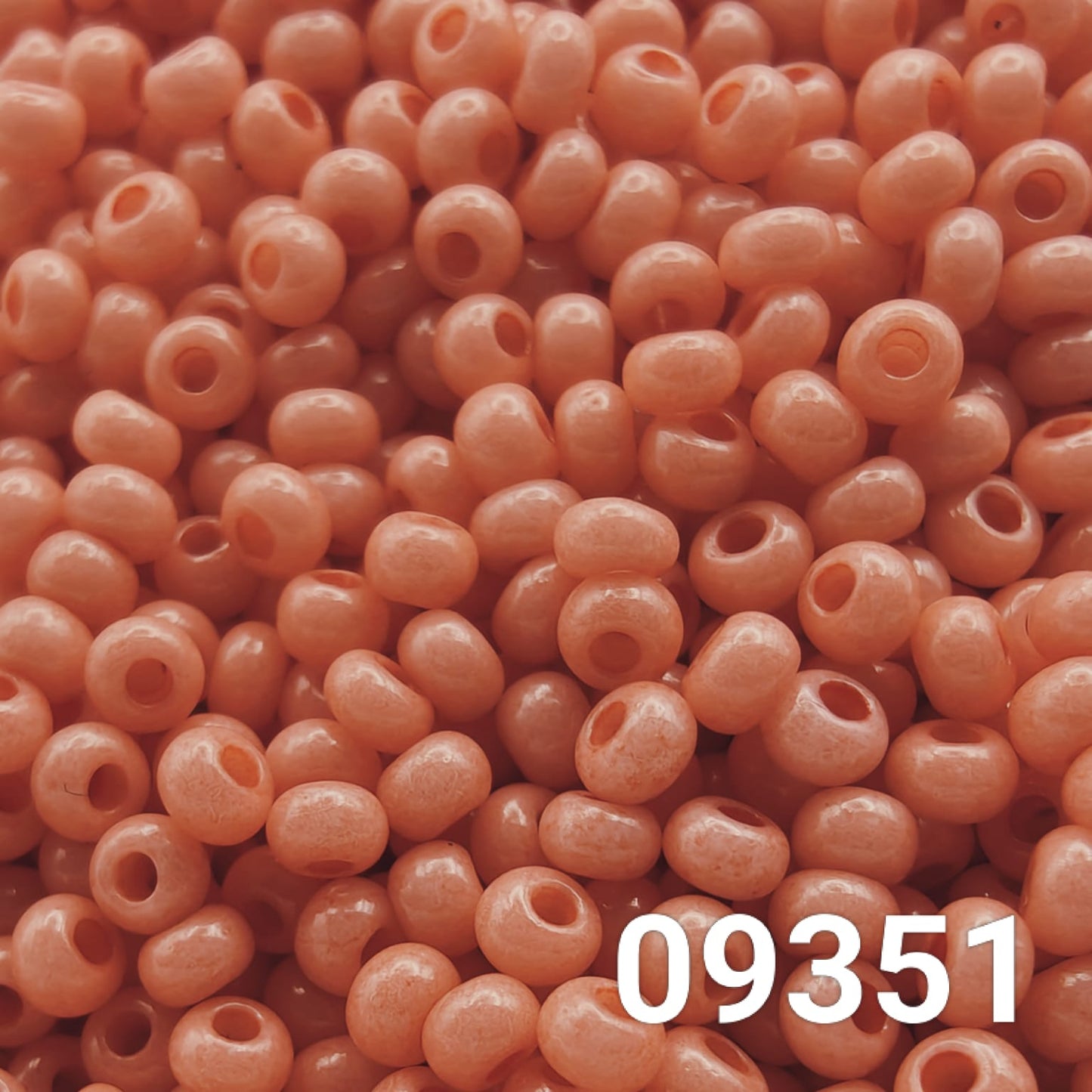 Close-up of Preciosa Czech seed beads 10/0 in dusty pink color 09351
