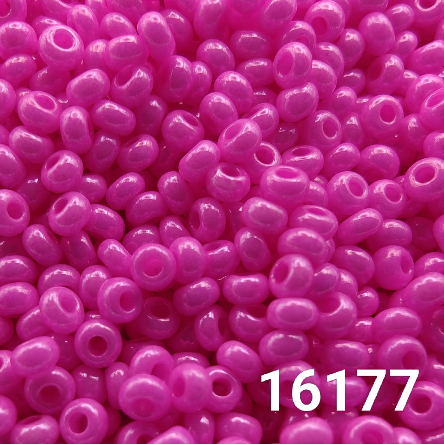 Close-up of Preciosa Czech seed beads 10/0 in opaque dyed chalk fuchsia color 16177