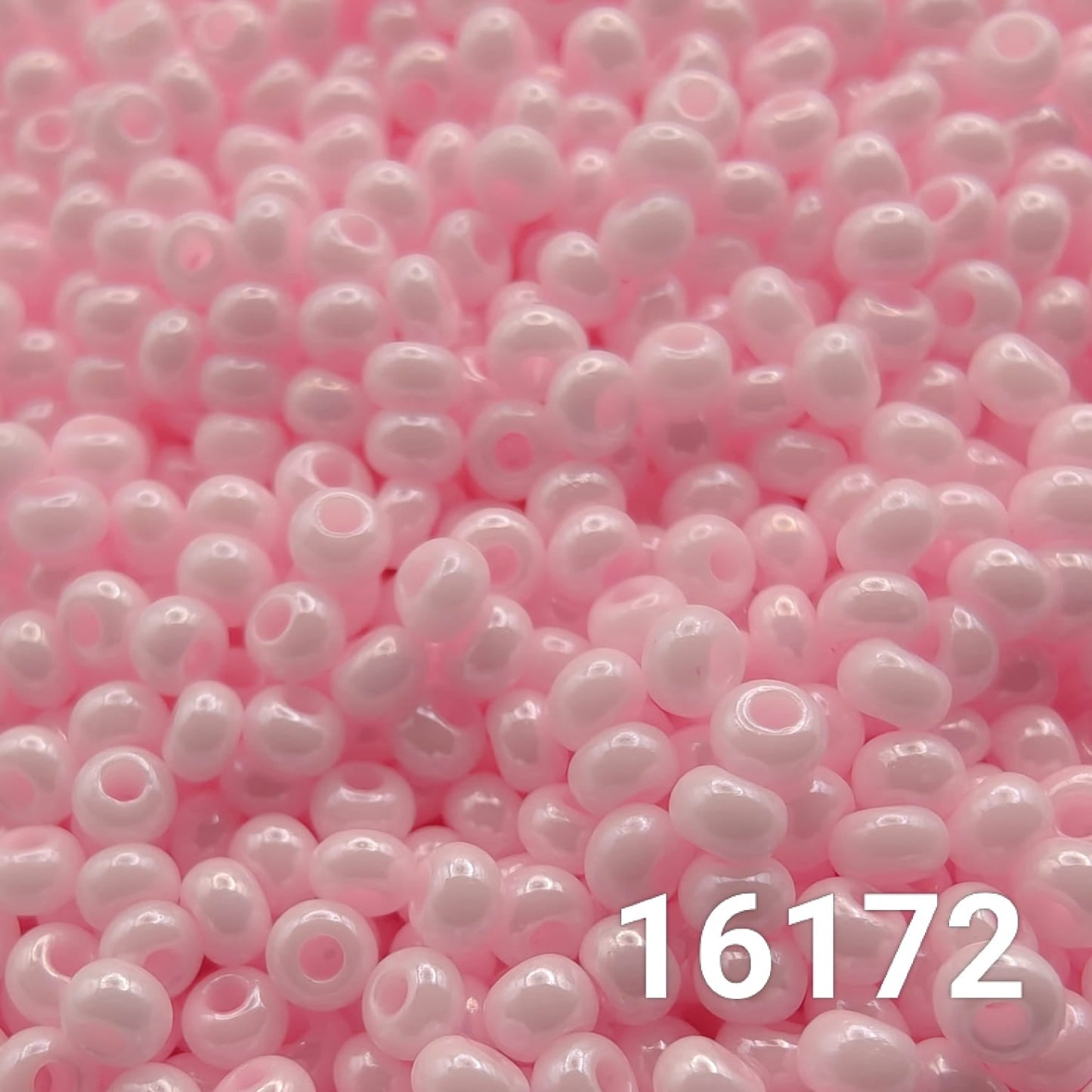 Close-up of Preciosa Czech seed beads 10/0 in opaque light pink color 16172