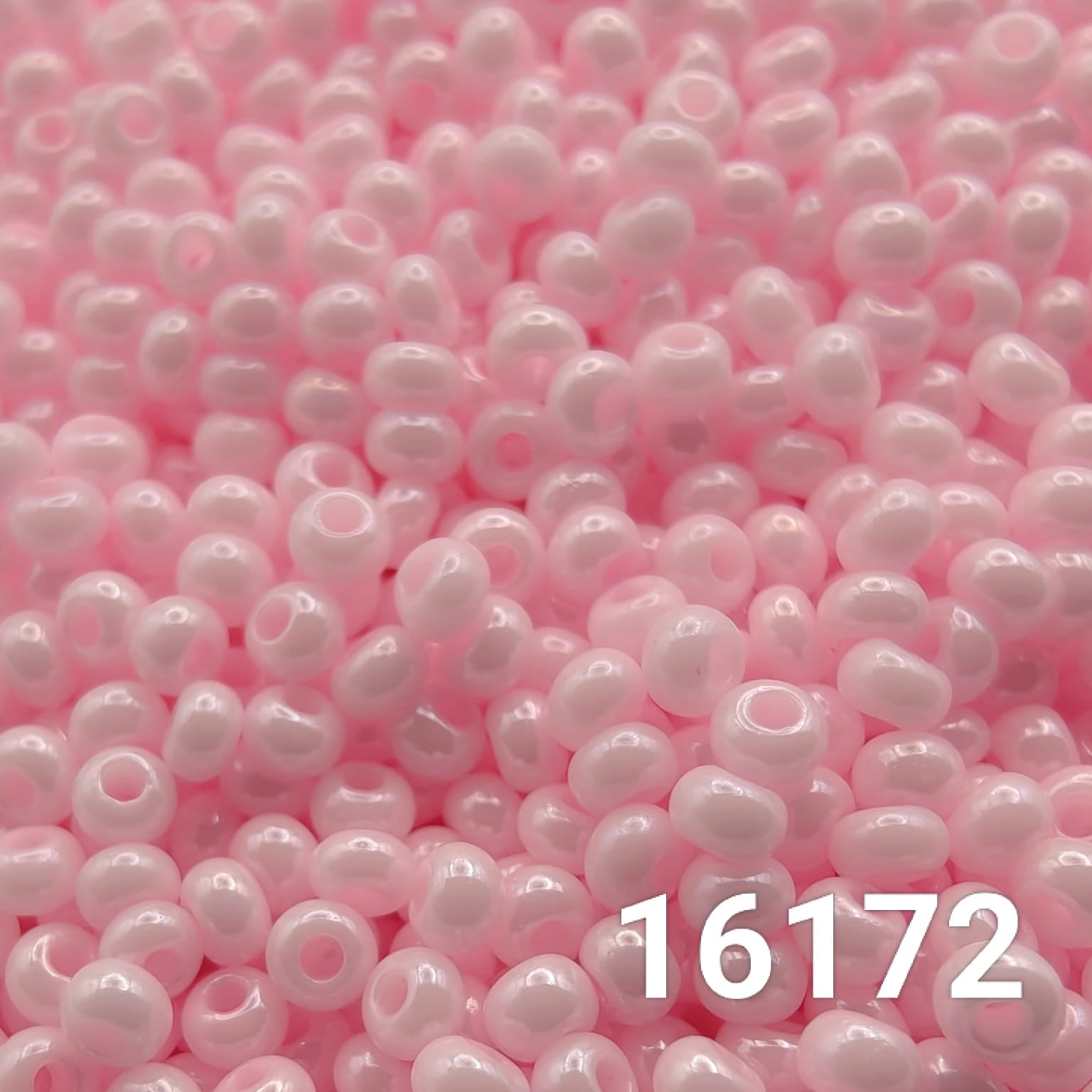 Close-up of Preciosa Czech seed beads 10/0 in opaque light pink color 16172