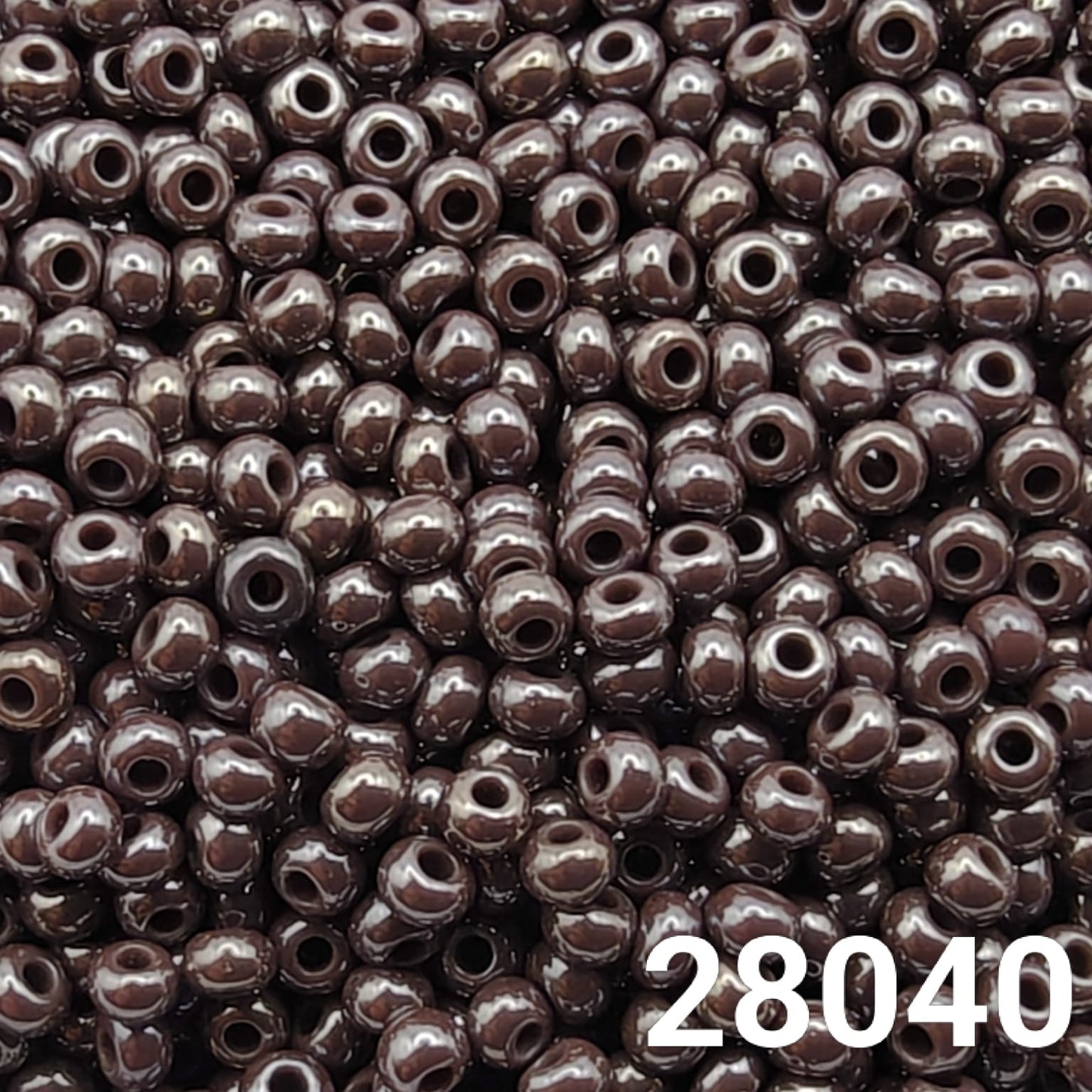 Close-up of round size 10/0 dark mauve luster seed beads by Preciosa