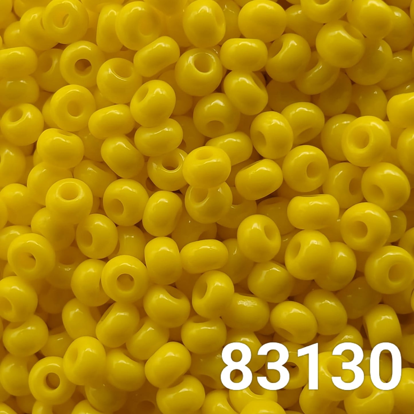 "Preciosa Czech seed beads 10/0 opaque yellow 83130 bulk close-up"