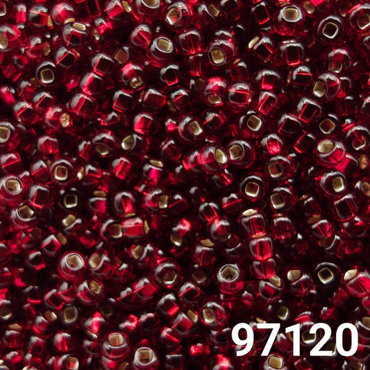 Close-up of Preciosa 10/0 seed beads in silverlined dark red color (97120)
