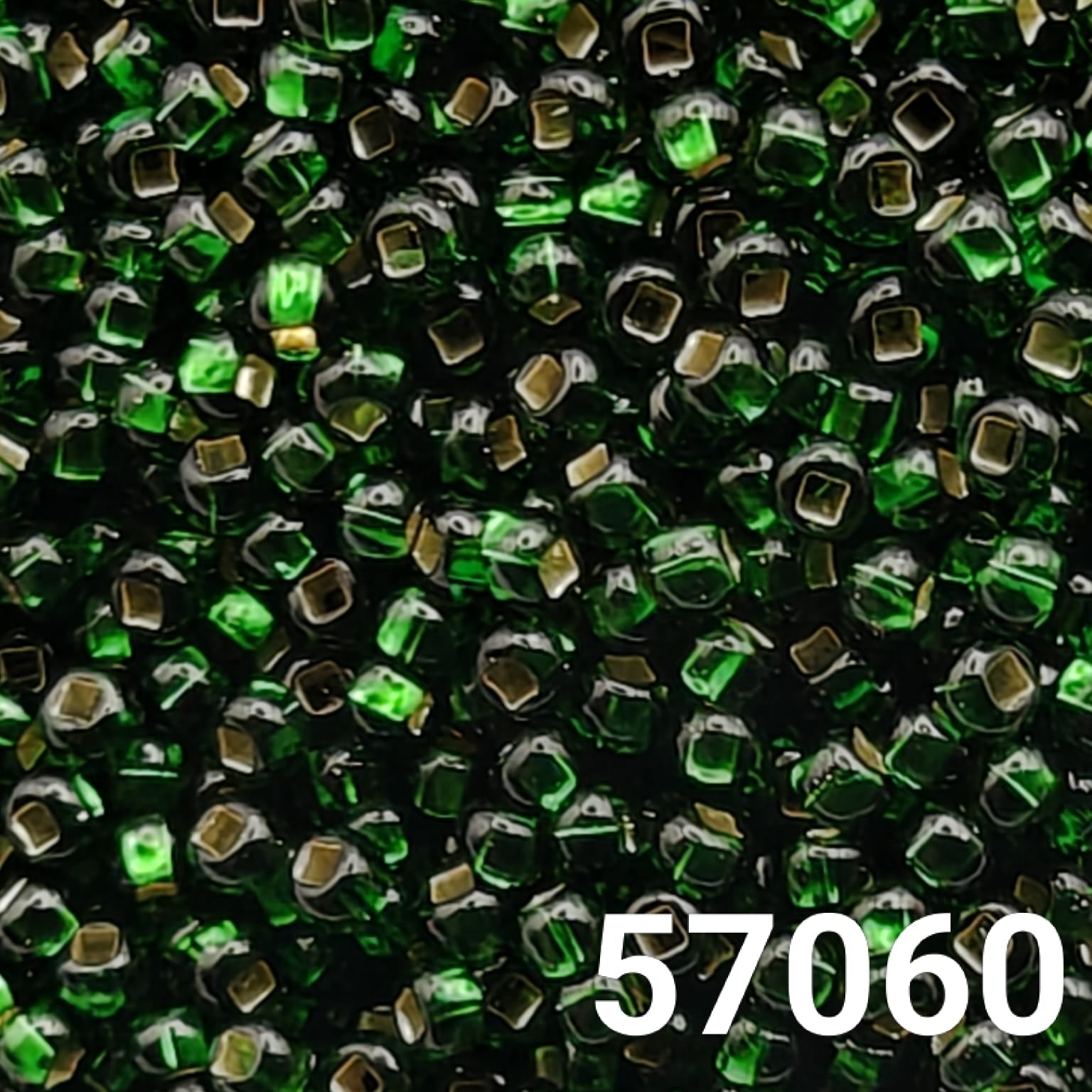 Close-up of Preciosa 10/0 seed beads in silverlined emerald green with square holes