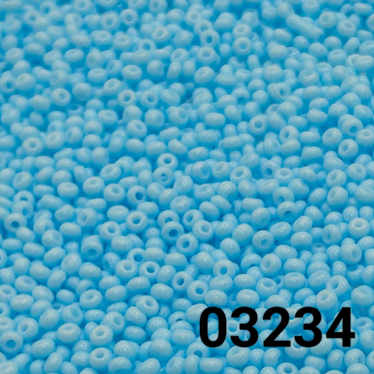 Close-up of PRECIOSA Czech seed beads 10/0 in Solgel Chalk Blue-Green, colour code 03234 – round glass beads with matte finish