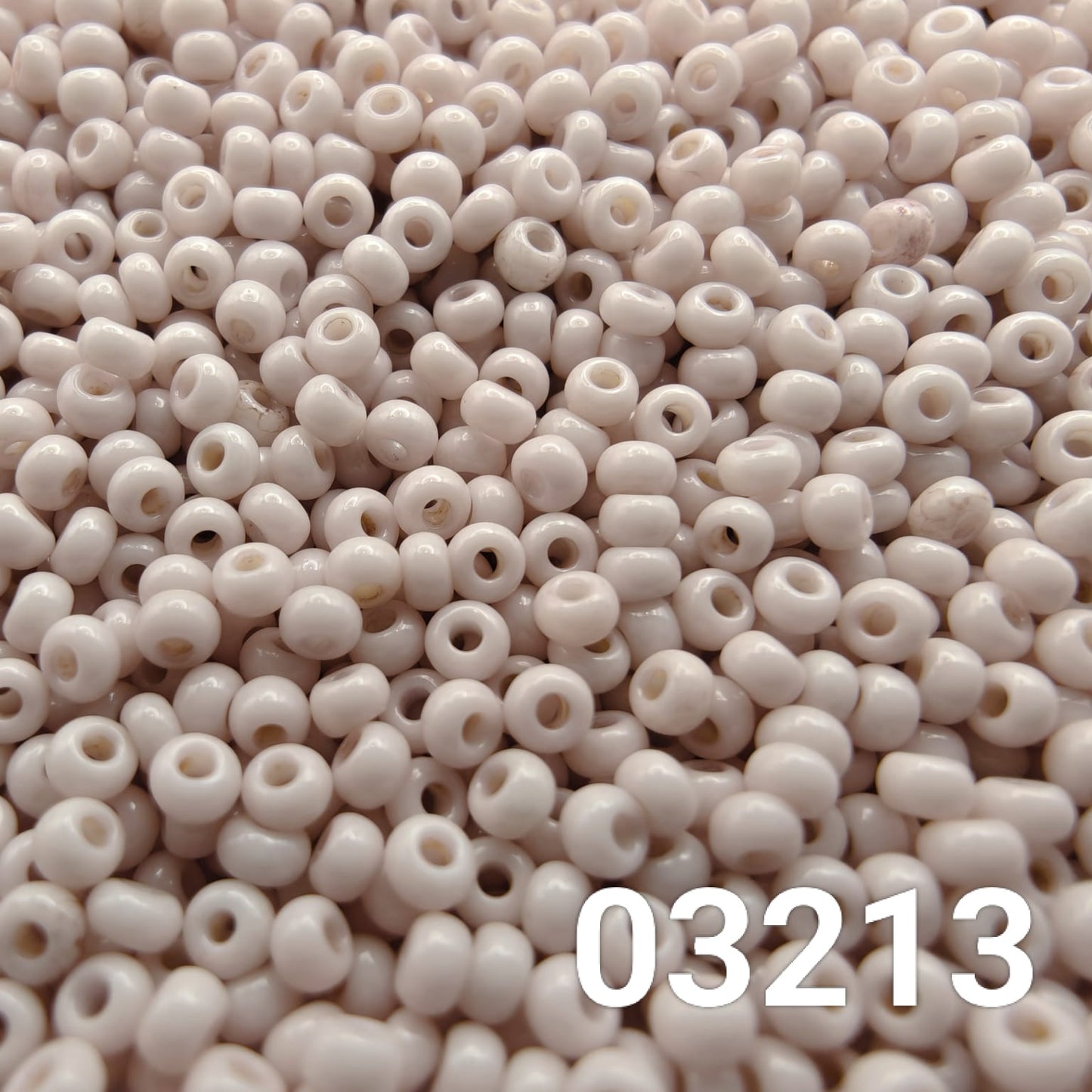 Close-up of Preciosa 10/0 seed beads in Solgel Chalk Lavender Fog color (03213)