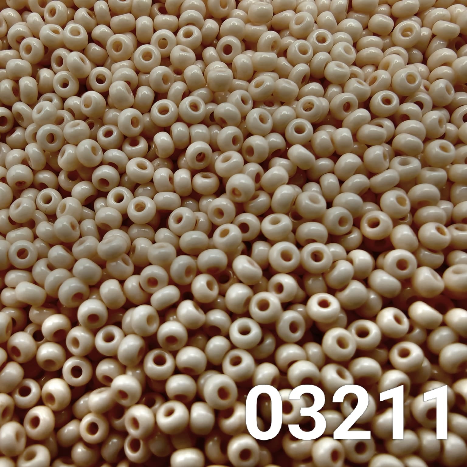 Close-up of Preciosa 10/0 seed beads in Solgel Chalk Peach Cream color (03211)