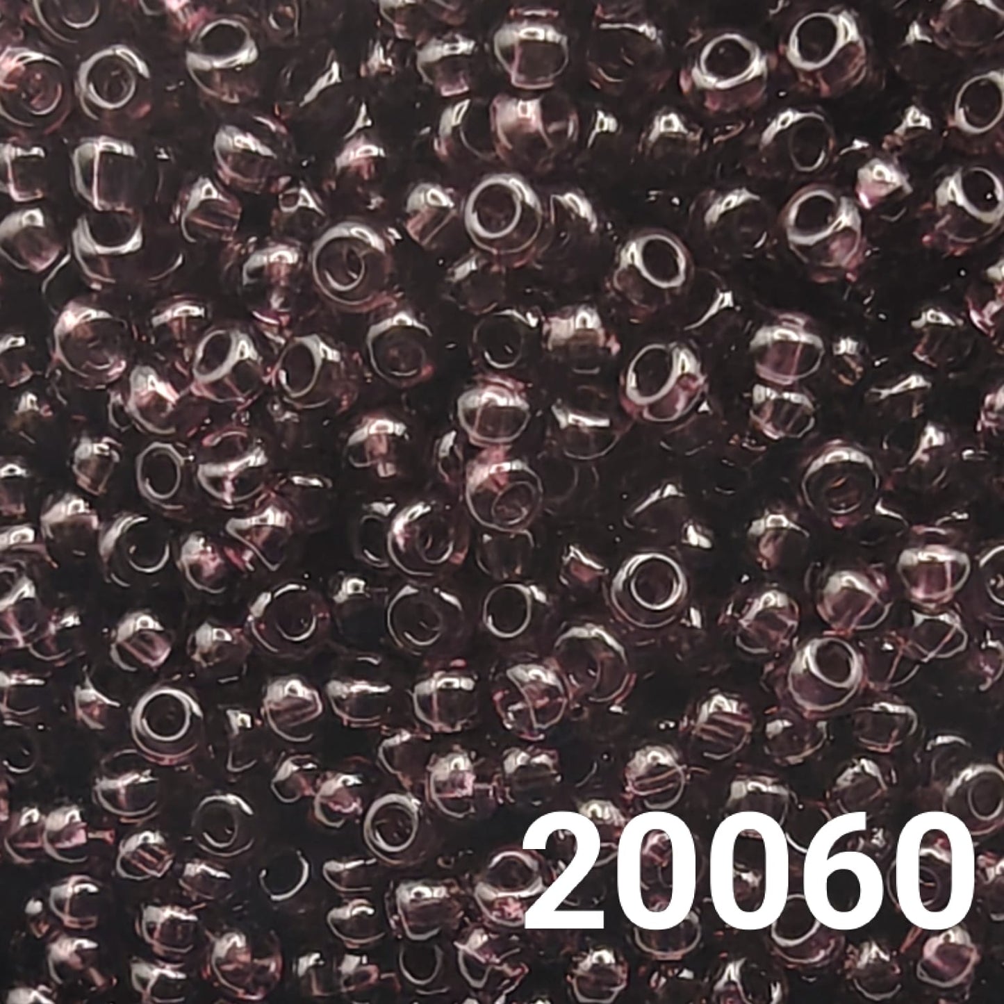 Preciosa 10/0 Transparent Amethyst seed beads close-up