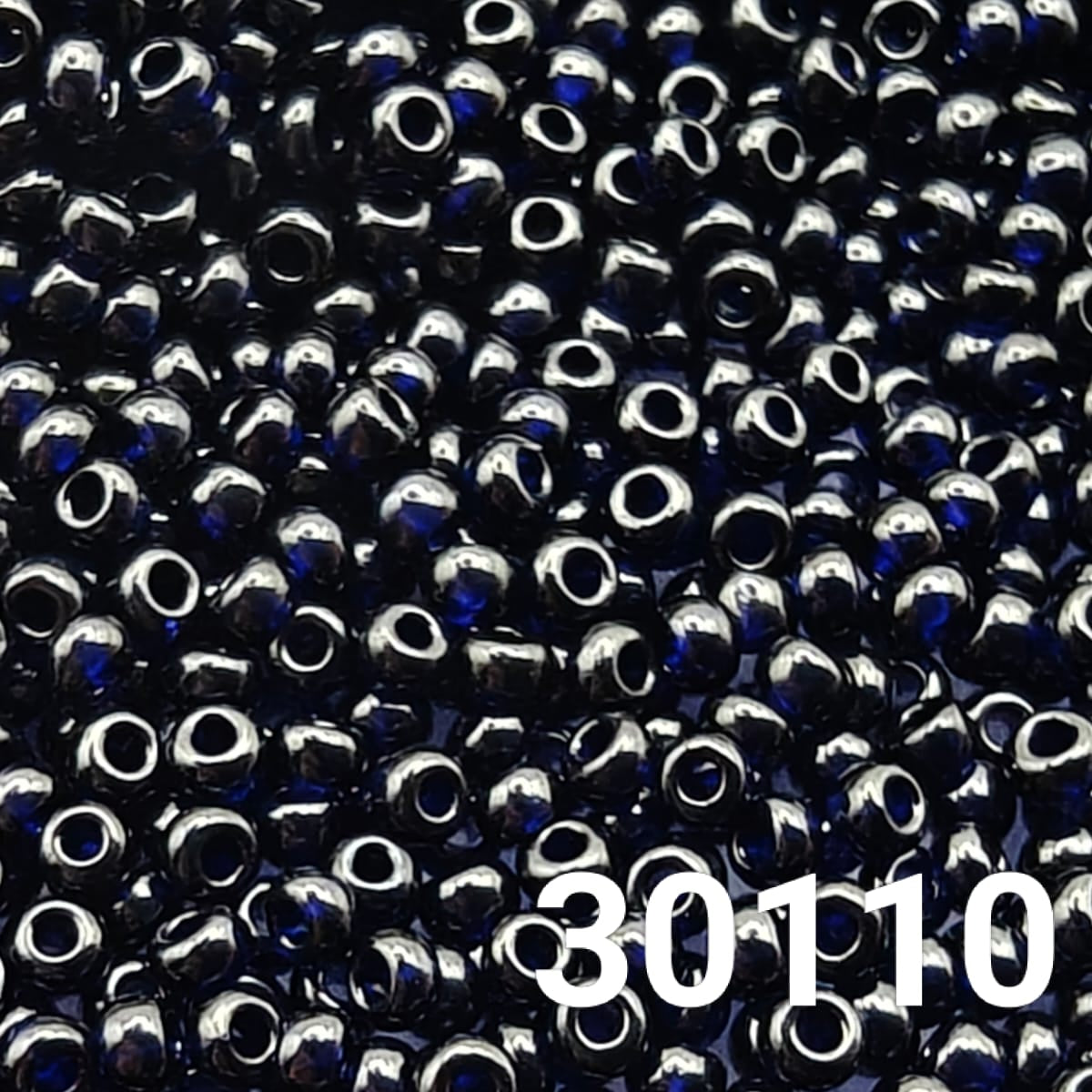Close-up of Preciosa 10/0 Transparent Dark Blue glass seed beads, code 30110, round uniform finish
