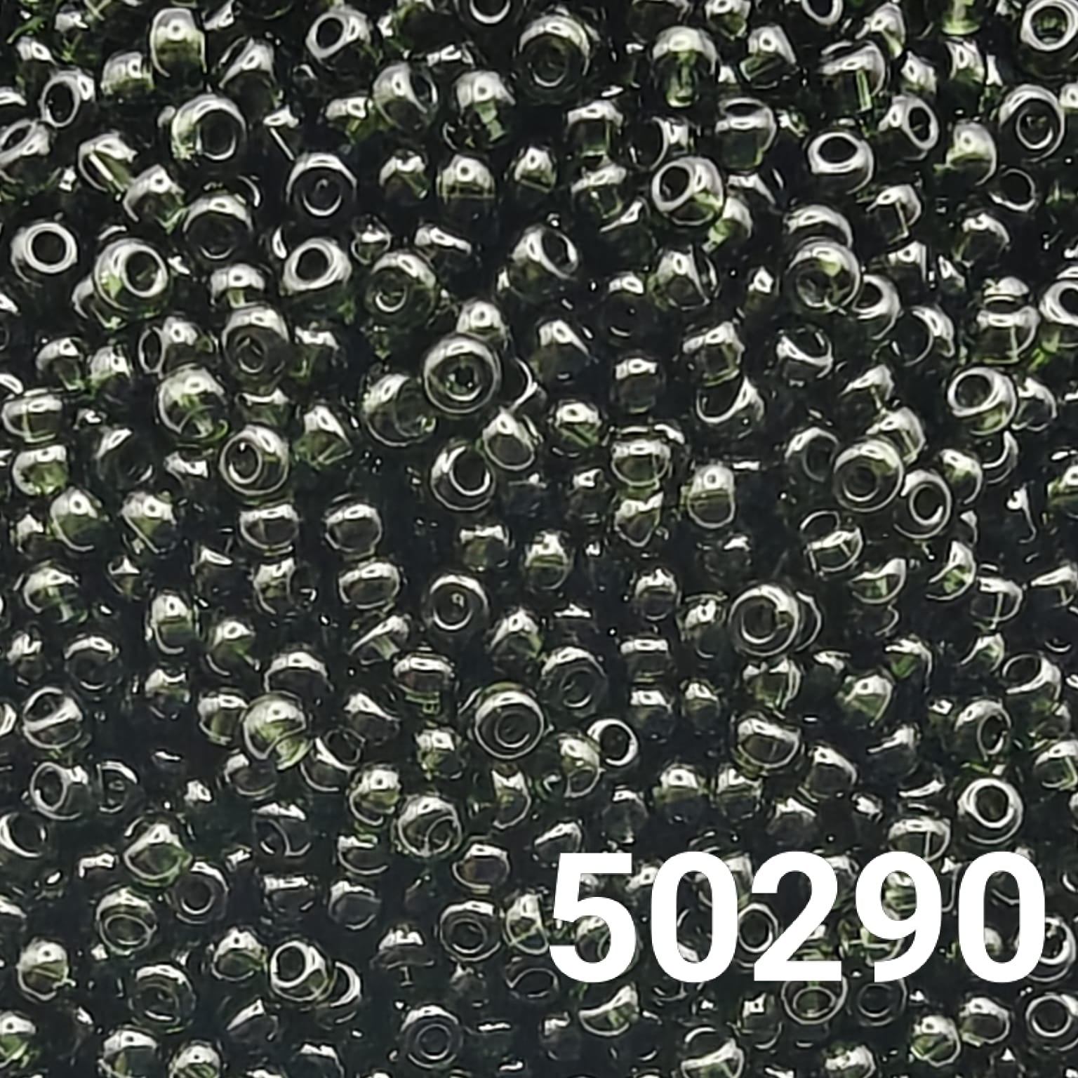 Close-up of 10/0 Transparent Dark Green Preciosa Ornela seed beads for jewelry making
