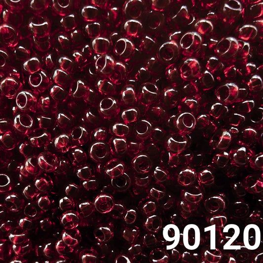 Close-up of Preciosa 10/0 seed beads in transparent dark red color (90120)