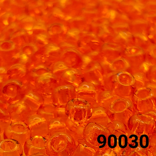 Close-up view of PRECIOSA Czech seed beads 10/0 in transparent orange hyacinth, colour code 90030 – round glass beads with smooth finish