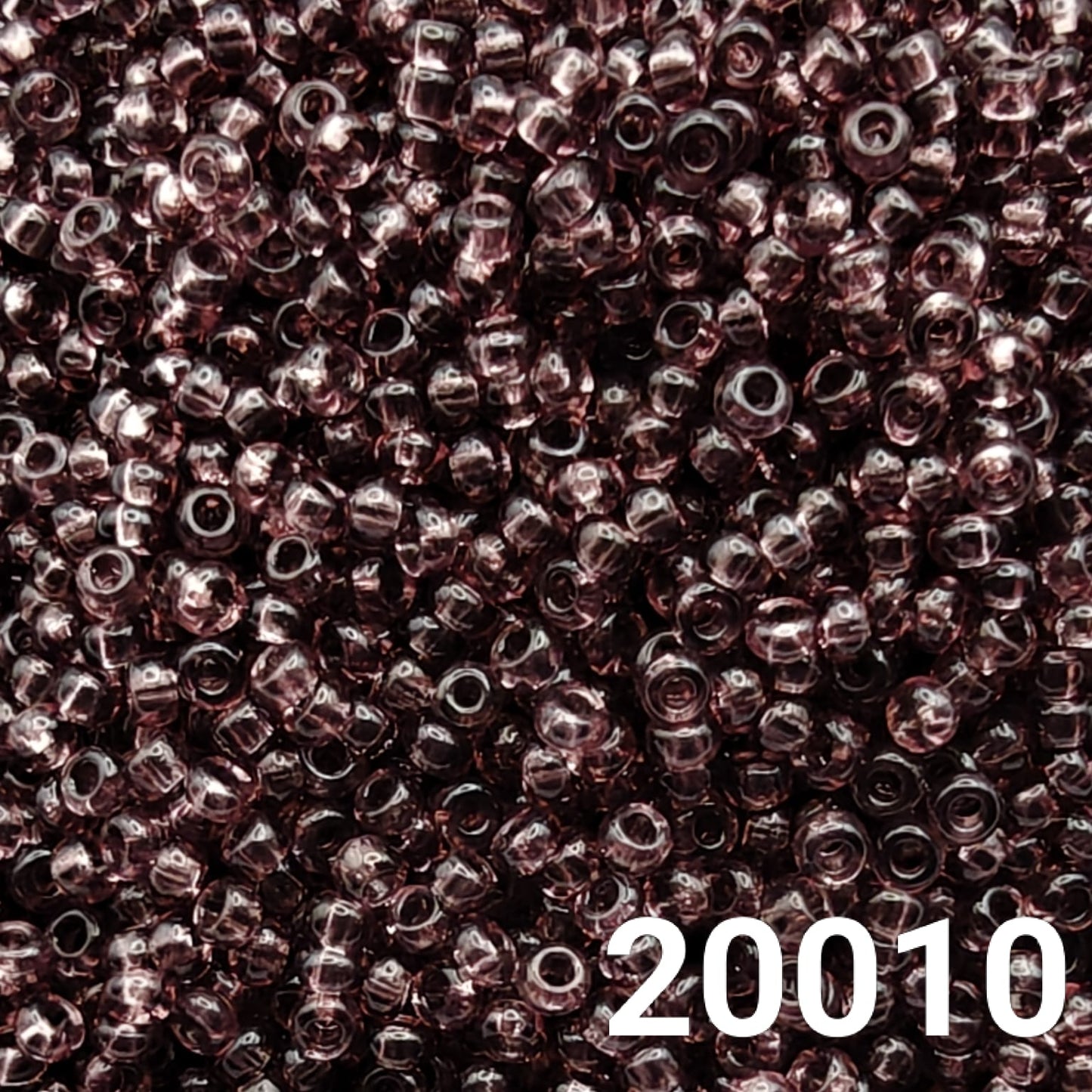 Close-up of Preciosa 10/0 seed beads in Transparent Light Amethyst color