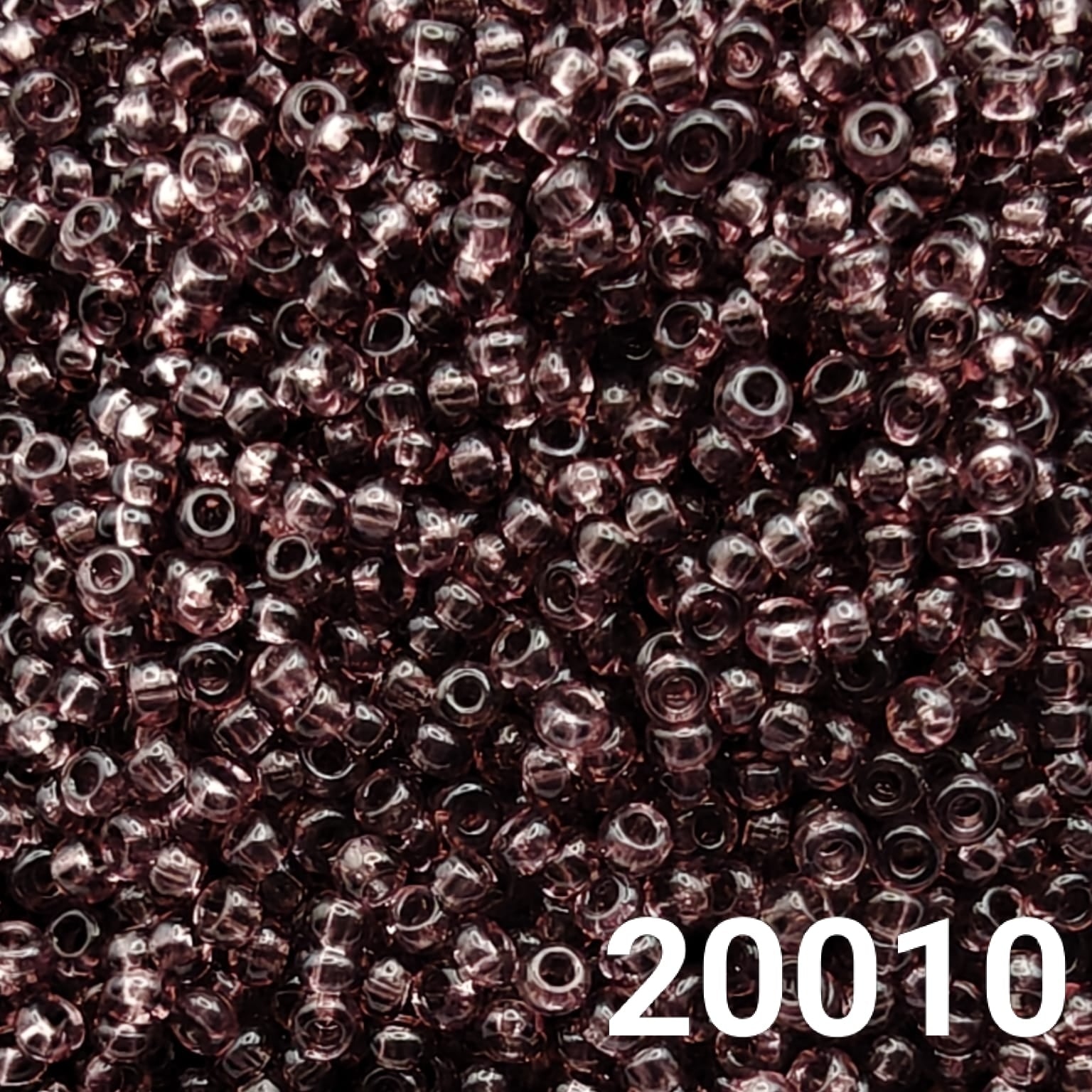 Close-up of Preciosa 10/0 seed beads in Transparent Light Amethyst color