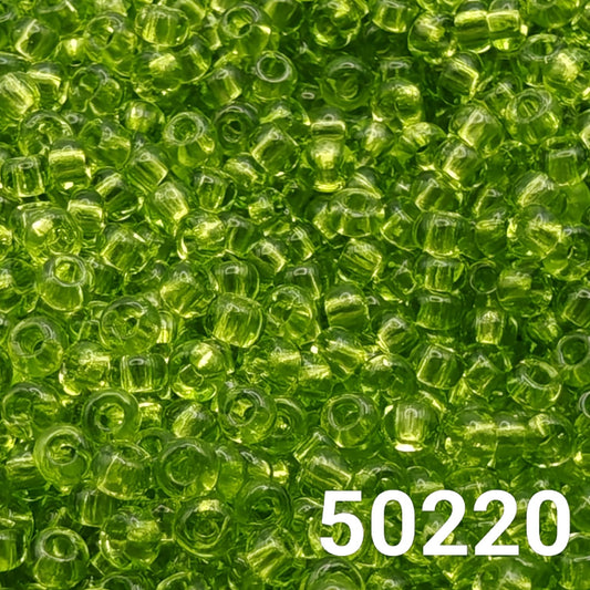 Close-up of Preciosa Czech seed beads 10/0 Transparent Light Green color code 50220