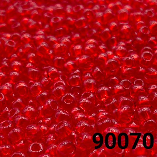 Close-up of PRECIOSA Czech 10/0 seed beads in transparent red, colour code 90070