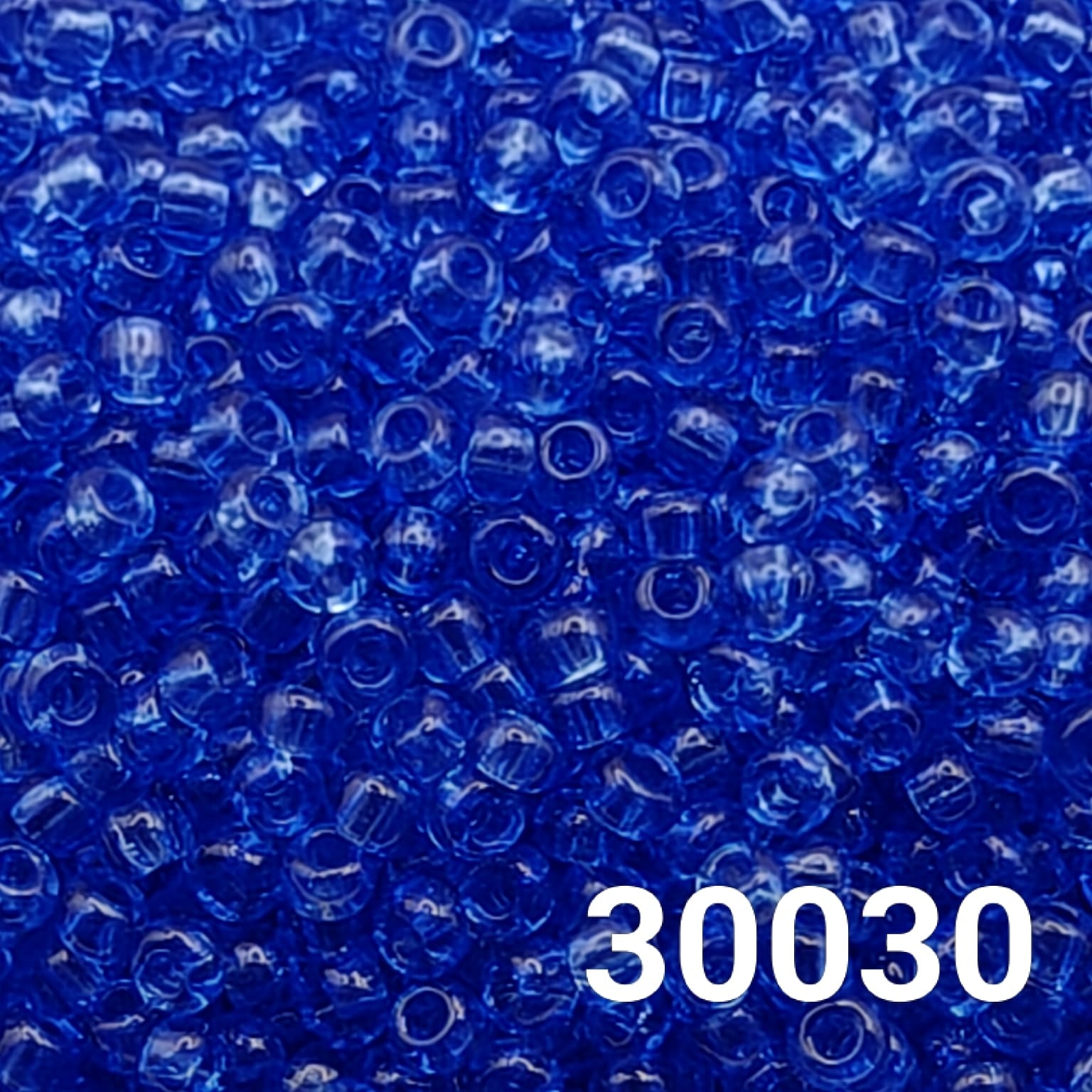 Close-up of Preciosa Transparent Light Sapphire seed beads 10/0 (code 30030)