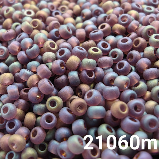Close-up of PRECIOSA 10/0 seed beads in frosted rainbow purple color (code 21060m)