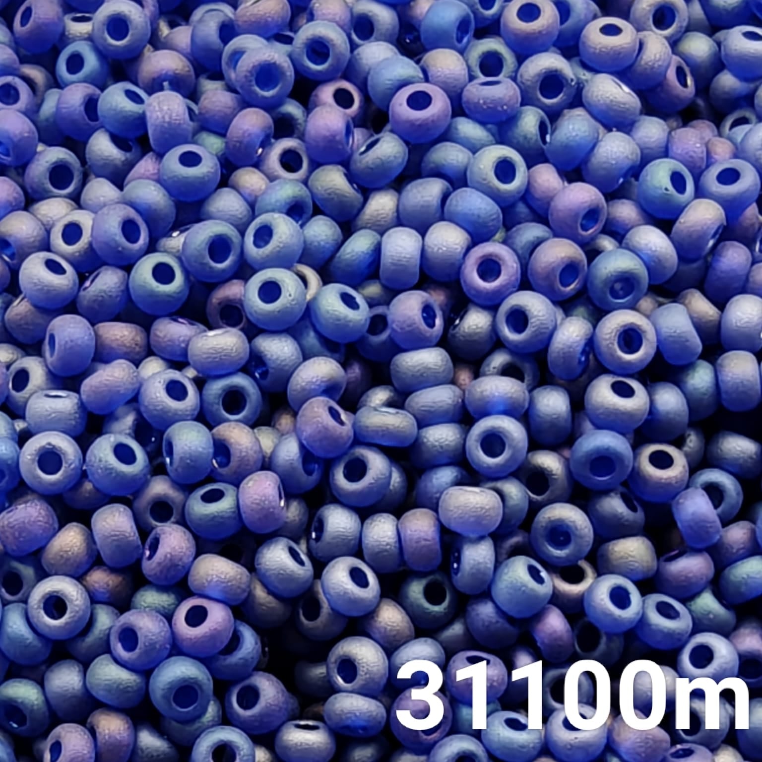 Close-up of Preciosa 10/0 seed beads in frosted rainbow transparent blue color (31100m)