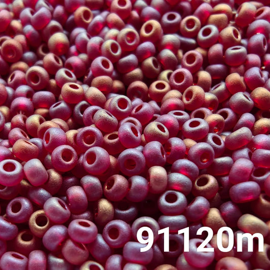 Close-up of PRECIOSA 10/0 matte transparent garnet red seed beads with rainbow AB finish, colour code 91120m – round frosted Czech beads