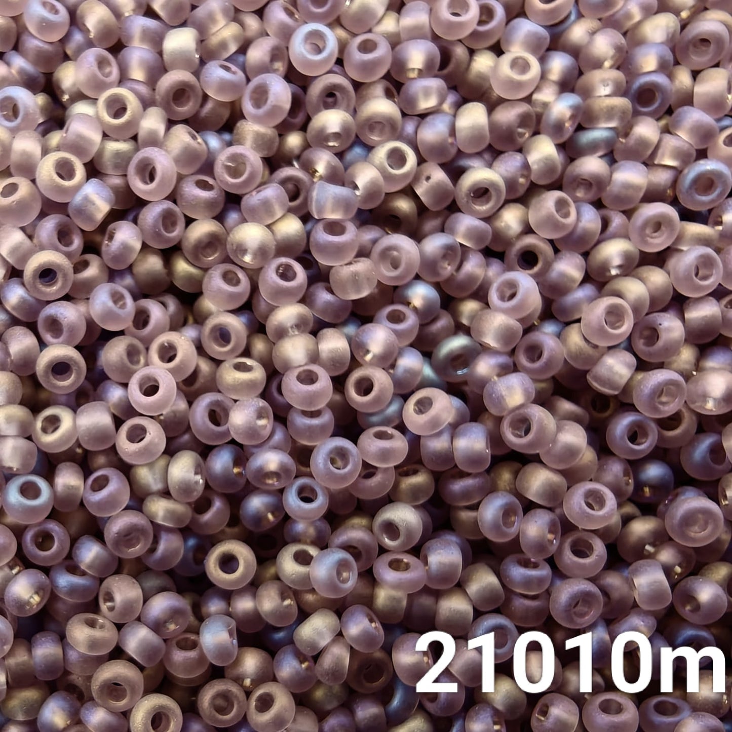 Close-up of Preciosa 10/0 seed beads in Transparent Matt Light Amethyst AB color (21010m)