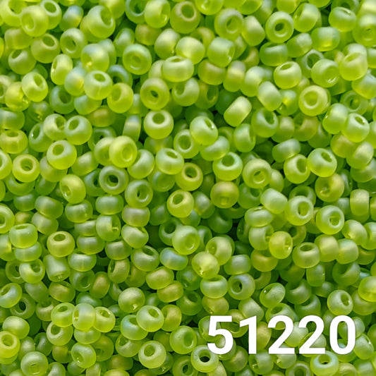 Close-up of Preciosa 10/0 seed beads in matte light green AB finish