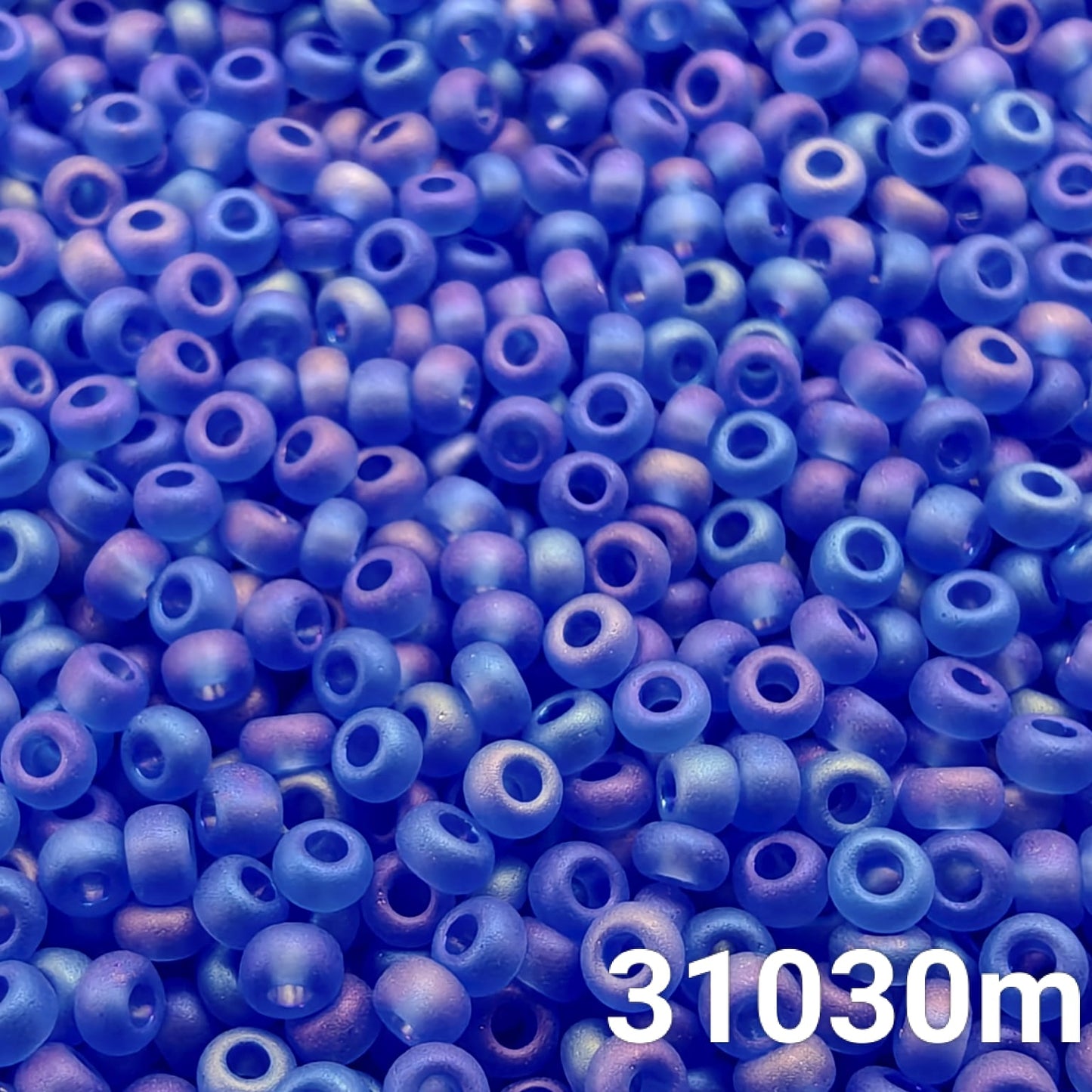 Close-up of Preciosa 10/0 seed beads in Transparent Matt Light Sapphire AB color (31030m)