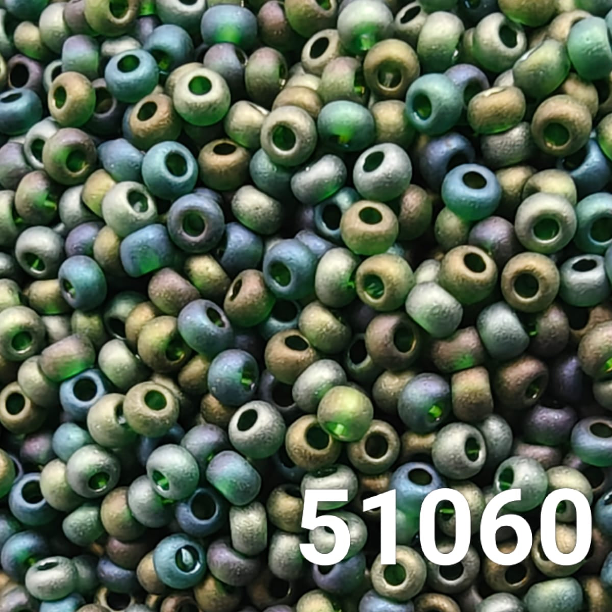 Close-up photo of frosted green AB Czech glass seed beads for crafts