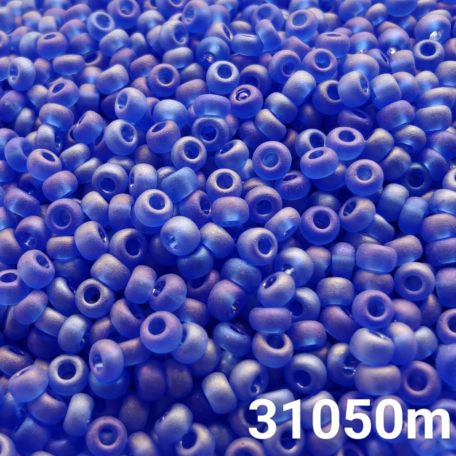 PRECIOSA 10/0 Transparent Matte Blue Rainbow Seed Beads – Close-up of round Czech glass beads for beading and embroidery