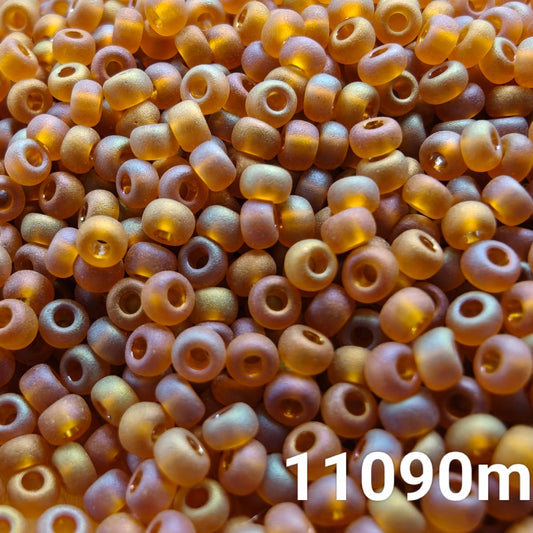 Close-up of PRECIOSA 10/0 seed beads in Transparent Matte Medium Topaz AB finish, colour code 11090m