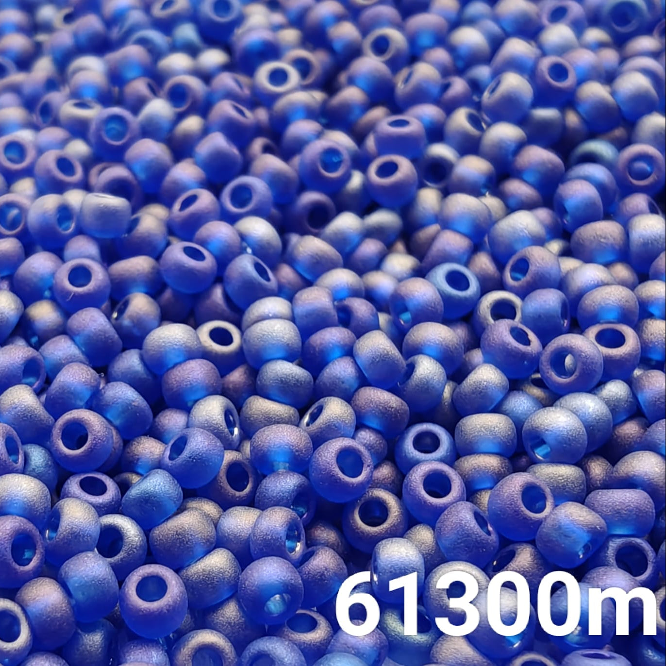 Transparent frosted rainbow navy blue Preciosa 10/0 seed beads close-up