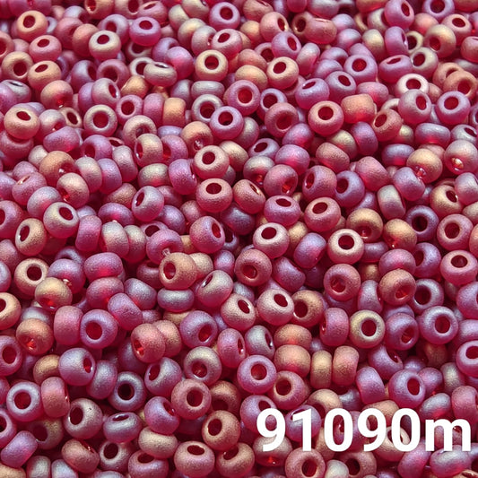 Close-up of Preciosa 10/0 seed beads in transparent matt ruby AB color (91090m)