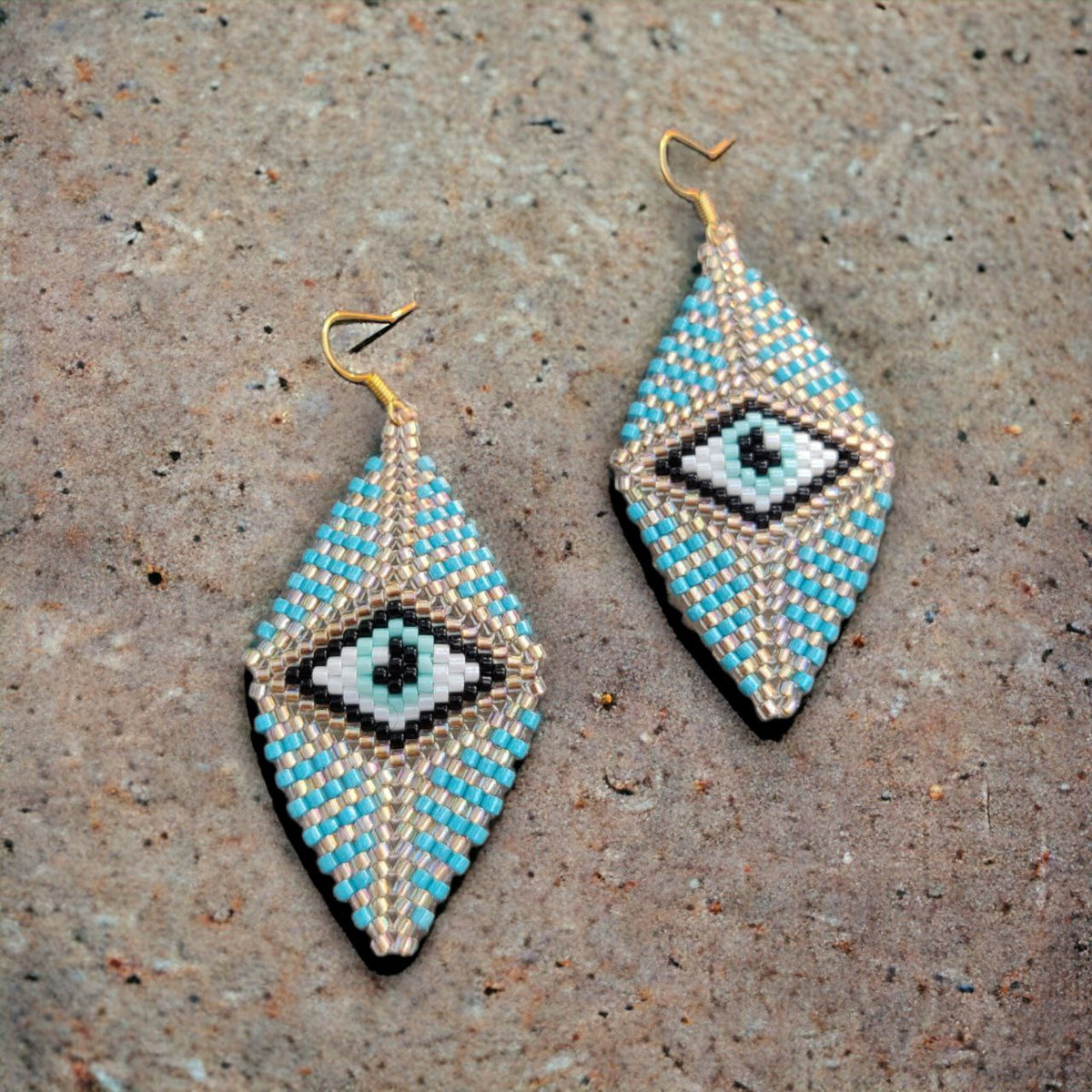 Evil-eye beaded earrings in diamond shape — top view